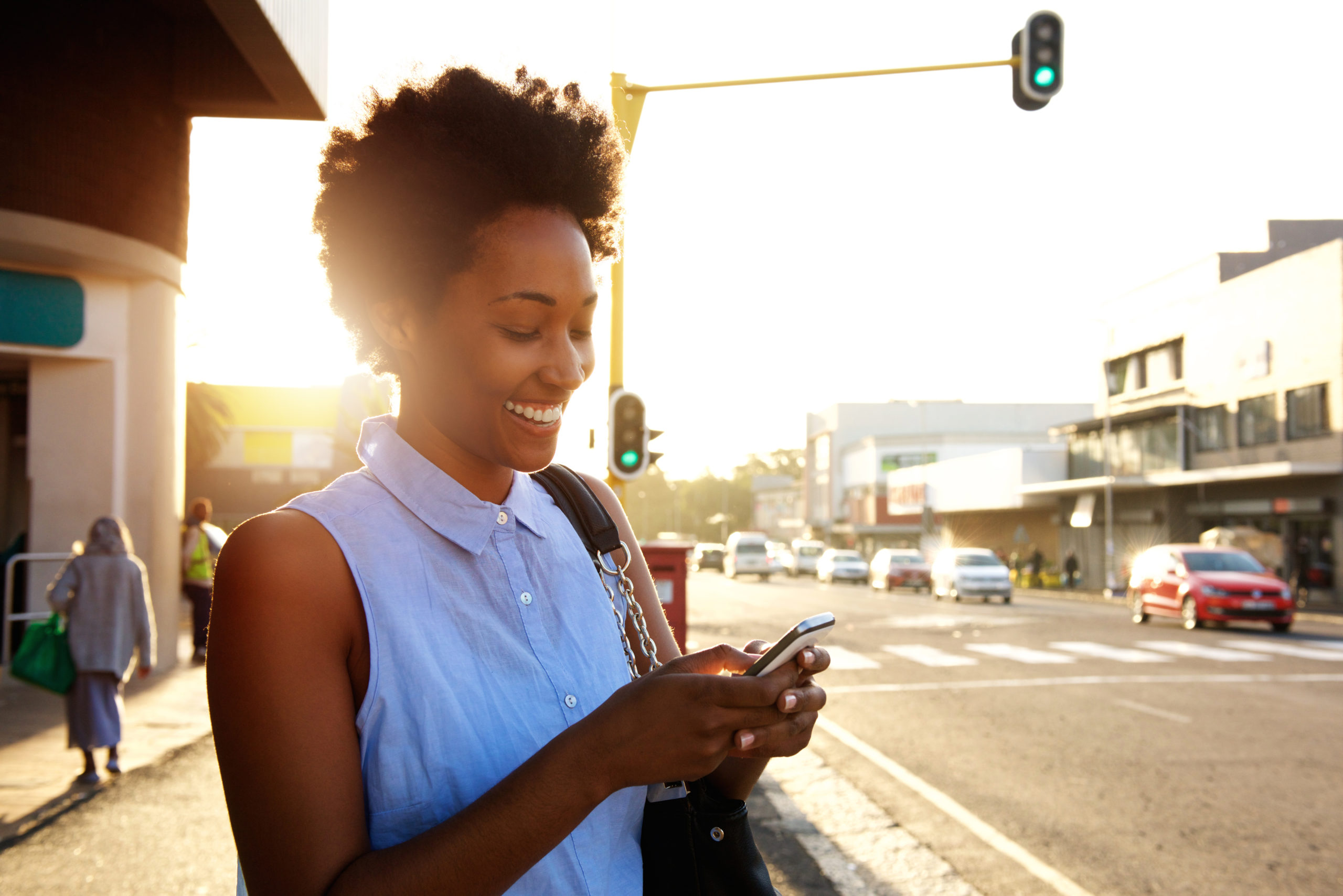 Young female lawyer checking emails on her phone