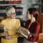 Legal Books and Criminal Law attorneys talking in library